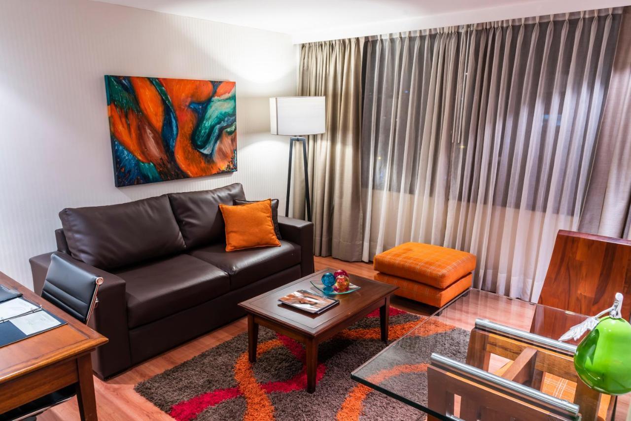 Bogota Plaza Hotel Exterior photo A living room in a typical apartment at the hotel